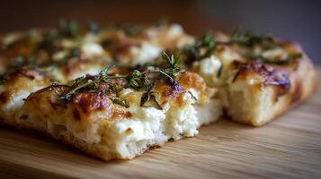Delicious Savory Focaccia Topped With Herbs and Cheese photo