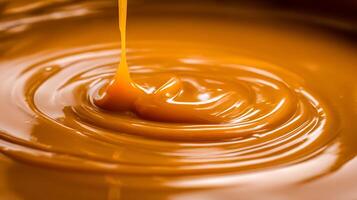 Rich Liquid Caramel Pouring and Swirling in a Smooth Texture. photo