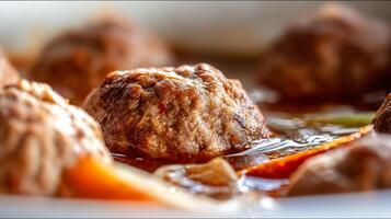 Close up shot of juicy meatballs simmering in a rich sauce. photo