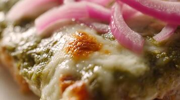 Close up macro view of melted cheese on bread with toppings. photo
