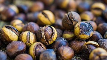 Close up of roasted chestnuts with shimmering details, perfect for autumn. photo