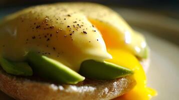 Rich Hollandaise Drizzle Over Avocado and Egg Breakfast. photo