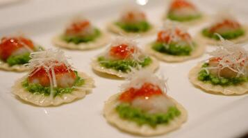 Delicious Appetizer Ravioli with Shrimp and Green Puree and Parmesan Cheese. photo