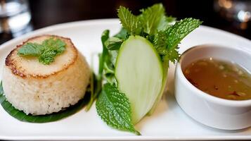 Delicious Vietnamese Com Tam Rice Plate with Herbs and Soup photo
