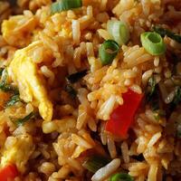 Delicious close up of asian fried rice with egg and green onions. photo