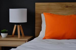 A white bed with a white pillow photo
