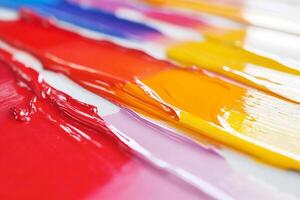 A close up of a paint brush with many colors photo