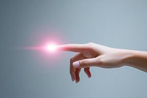 A person's hand is holding a glowing object photo