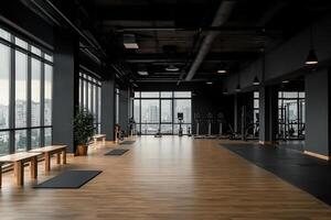 A gym with wooden floors and windows photo