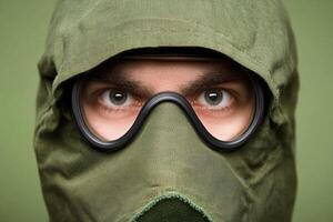 A man wearing a gas mask and goggles photo