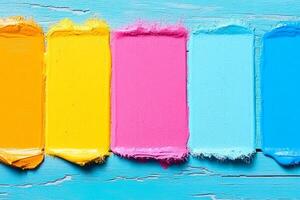 Colorful paint on a wooden background photo