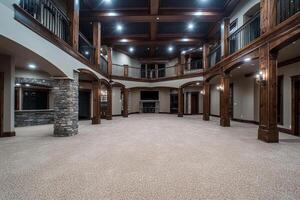 A large room with a stone fireplace and a large ceiling photo