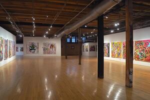 An art gallery with many paintings on the walls photo