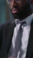 Close up focused concentrated African American man businessman business male ethnic guy office worker manager employee typing computer keyboard pc online internet job executive working browsing indoor video