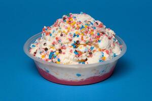 A bowl of ice cream with sprinkles on top photo