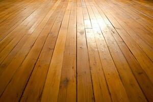A wooden floor with a light shining on it photo