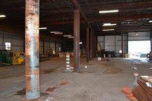 A large warehouse with a lot of equipment in it photo