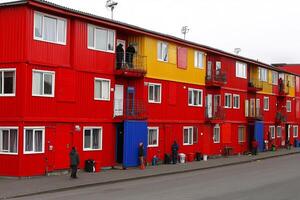 A red building with a blue and yellow facade photo