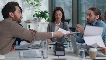 Stressed unhealthy Caucasian team leader businesswoman holding head ache headache pain suffering medicine multiethnic colleagues diversity business people arguing conflict shouting yelling in office video