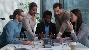 Diversity businesswomen businessmen Caucasian African Indian men women talk discussion project smiling in office business plan strategy together teamwork coworkers colleagues analyzing graph briefing video