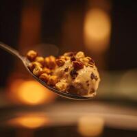 Delicious Hazelnut Ice Cream on a Spoon with Warm Bokeh Background. photo