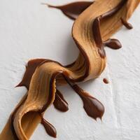 Smooth Peanut Butter Drizzled with Rich Chocolate Sauce. photo