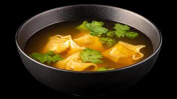 A Warm Bowl of Wonton Soup with Fresh Cilantro. photo