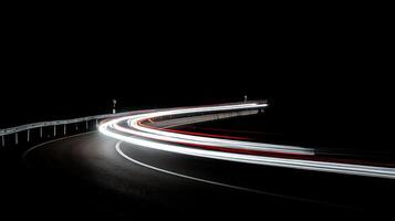 Night highway light trails show fast movement and speed on the road. photo