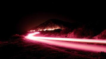 Journey Through The Night Red Light Trails On A Mountain Road. photo