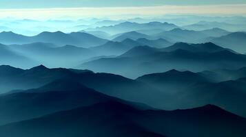 Ethereal Blue Mountains Layered in Fog and Mist. photo