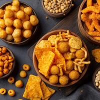 A Delicious Mix of Savory Snacks in Wooden Bowls. photo