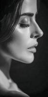 Black and white portrait of a woman with long eyelashes photo