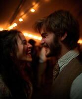 Young couple laughs face to face at evening celebration photo