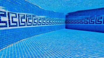 An empty swimming pool with blue tiles video