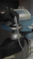 ultrasound-assisted liposuction device in action, focusing on removal of fat from abdomen of patient in cosmetic clinic. It removes belly fat in beauty salon. video