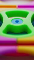 Colorful plastic gears from a kids educational toy set. Great for illustrating concepts of play-based learning, coordination, mechanics, and STEM development in early childhood. video