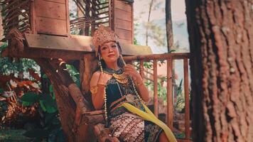 Beautiful Javanese Dancer Posing in a Rustic Treehouse video