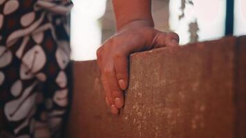 Close-up of a Hand Resting on a Ledge video