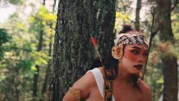 Traditional Javanese Archer Performing by a Forest Tree video