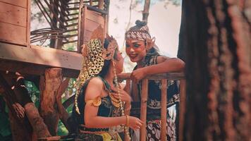 Playful Javanese Dancers Interacting in a Treehouse video