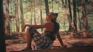 Pensive Javanese Archer Resting in a Pine Forest video