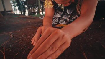 Close-up of a Javanese Dancer's Hands in the Soil video