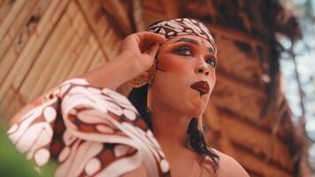Javanese Dancer Adjusting Ear Accessory Before Performance video