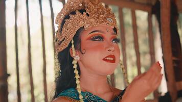 Graceful Javanese Dancer Posing in a Forest Hut video
