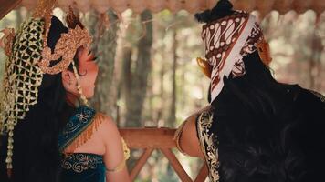 Javanese Couple Talking and Laughing on a Forest Balcony video