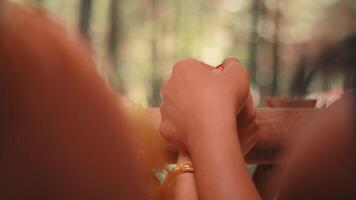 Couple Holding Hands on a Balcony Railing video