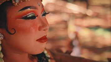 Rack Focus Between a Javanese Dance Couple in a Forest video