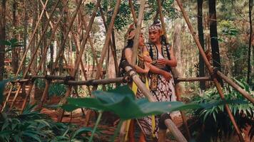 Javanese Couple Leaving a Bamboo Structure in the Forest video