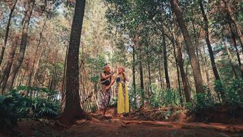Javanese Couple in a Forest Clearing Looking Up video