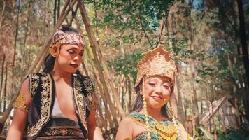 Traditional Javanese Couple Looking Around in a Forest video